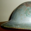 An RCR Brodie helmet with painted badge (O'Leary Collection)