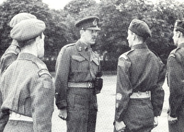 Reproduced from the regimental history (Second Volume), this photo shows both patterns of regimental shoulder flash in use in September 1945.  - Maj.-Gen. D.C. Spry, DSO, speaks to CSM G.E Peppard, who was three times wounded while serving with the Regiment, at the last formal inspection of the Regiment at No. 7 Repat Depot.