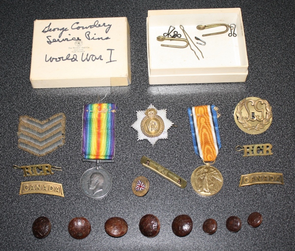 The contents of the small box that contained 739068 Private George Cowdery's medals and associated items.