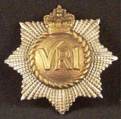 The early pattern of the Imperial crown badge of The RCR, designed in 1926